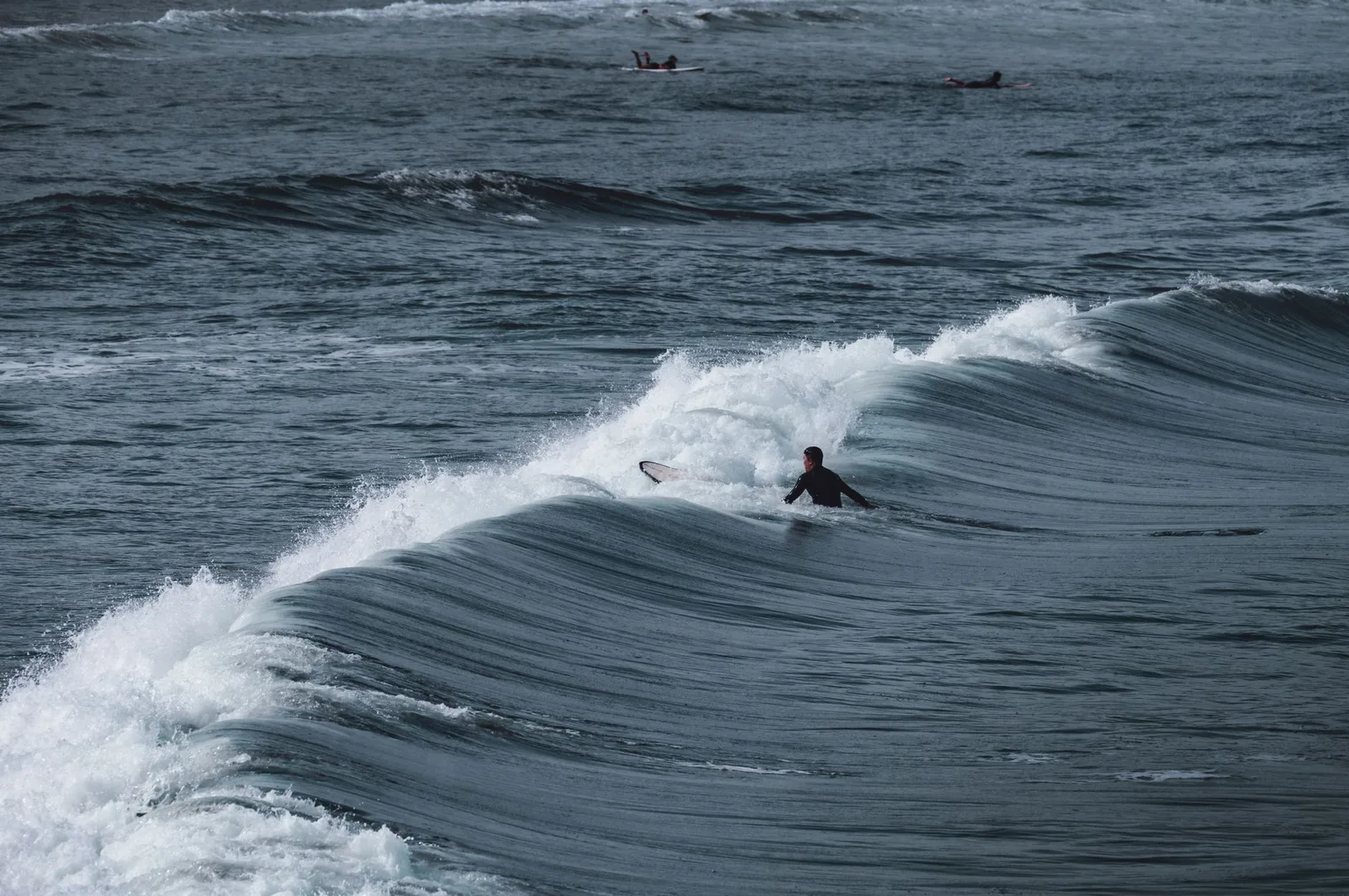 Exciting surfing scene capturing a surfer riding the ocean waves with skill.